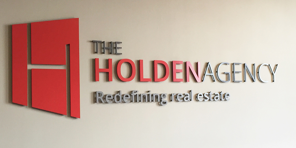 Wall sign at The Holden Agency office