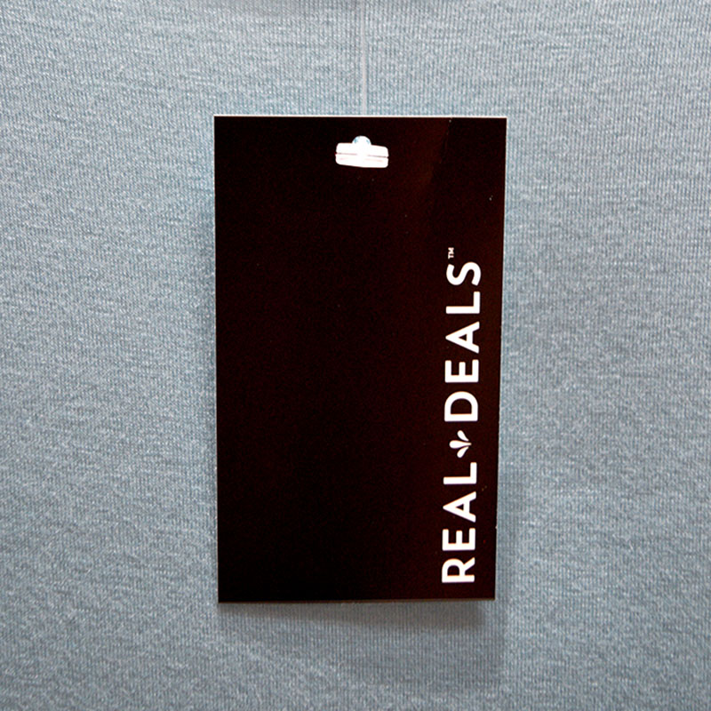 Branded clothing tag hanging on shirt